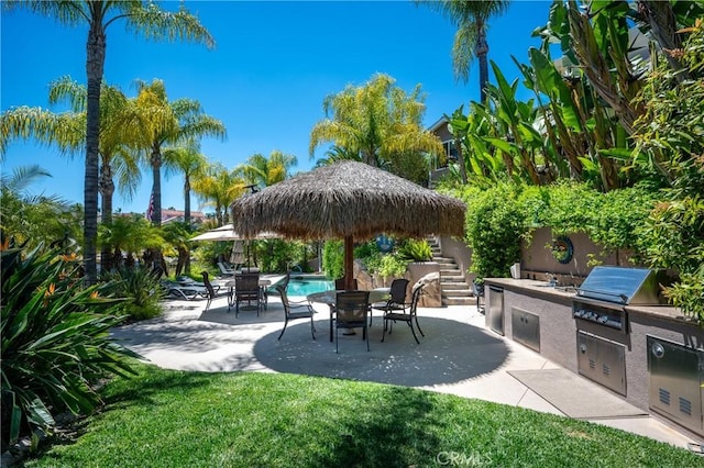 29784 Nautical Ct, Canyon Lake, CA 92587 - view of patio / terrace featuring an outdoor kitchen, stairway, grilling area, and outdoor dining area