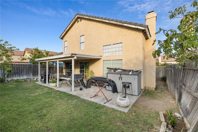 12018 Cherrywood Dr, Fontana, CA 92337 - rear view of house with a chimney, a fenced backyard, a patio, and stucco siding