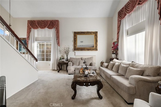 12018 Cherrywood Dr, Fontana, CA 92337 - living room featuring plenty of natural light, stairs, and carpet