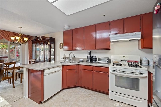 12018 Cherrywood Dr, Fontana, CA 92337 - kitchen featuring white appliances, under cabinet range hood, a peninsula, a chandelier, and light countertops