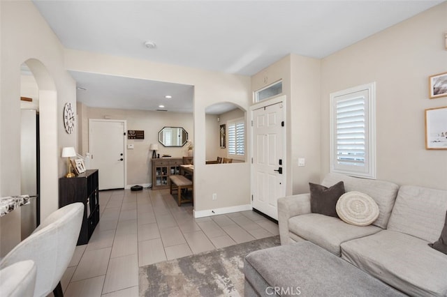 130 Bloomfield Ln, Rancho Santa Margarita, CA 92688 - living area featuring arched walkways, recessed lighting, baseboards, and tile patterned flooring