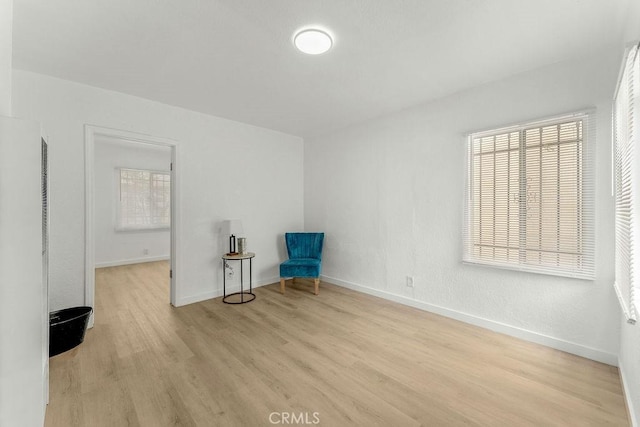 9309 S Broadway, Los Angeles, CA 90003 - unfurnished room featuring light wood finished floors, baseboards, and plenty of natural light