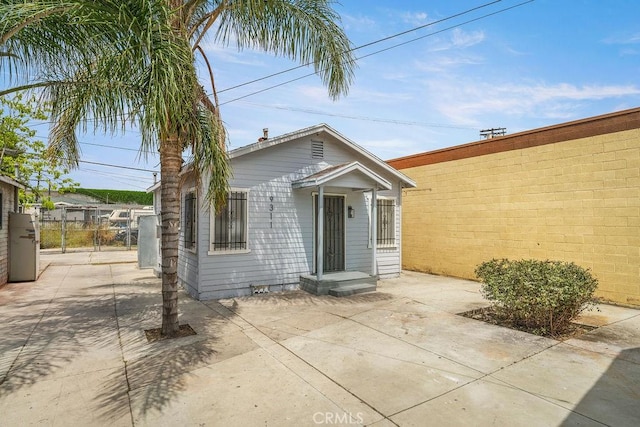 9309 S Broadway, Los Angeles, CA 90003 - rear view of house with fence and a patio