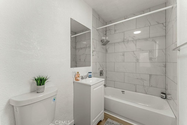 9309 S Broadway, Los Angeles, CA 90003 - bathroom with tub / shower combination, toilet, vanity, and a textured wall