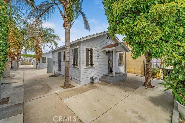 9309 S Broadway, Los Angeles, CA 90003 - view of front of home with crawl space, fence, and a patio