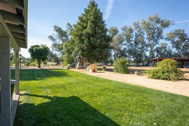 49 Bob Way, Oroville, CA 95965 - view of grassy yard featuring a playground