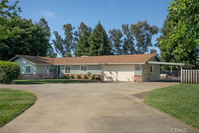 49 Bob Way, Oroville, CA 95965 - ranch-style house featuring concrete driveway, a carport, an attached garage, and brick siding