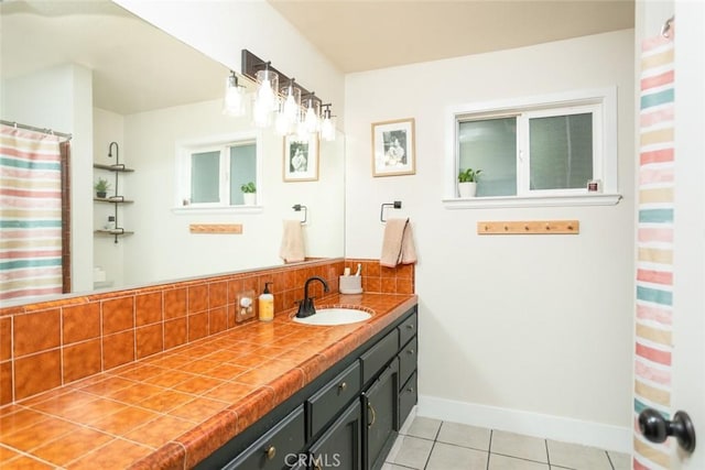 49 Bob Way, Oroville, CA 95965 - bathroom featuring tasteful backsplash, tile patterned floors, vanity, and baseboards