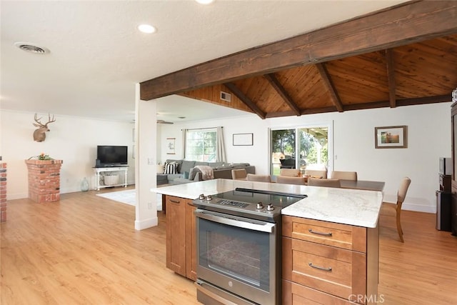 49 Bob Way, Oroville, CA 95965 - kitchen with stainless steel electric stove, open floor plan, light wood-style flooring, recessed lighting, and baseboards