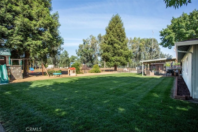 49 Bob Way, Oroville, CA 95965 - view of grassy yard with a playground