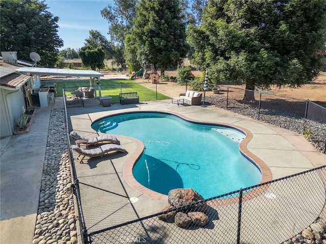 49 Bob Way, Oroville, CA 95965 - view of pool featuring a playground, a patio, and view of scattered trees