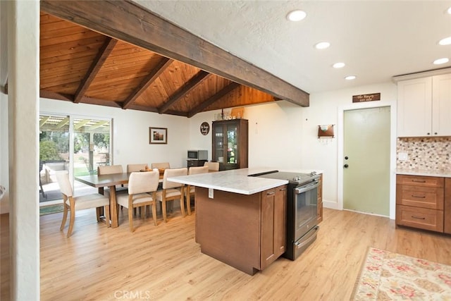 49 Bob Way, Oroville, CA 95965 - kitchen featuring stainless steel electric range, light wood finished floors, recessed lighting, tasteful backsplash, and white cabinetry