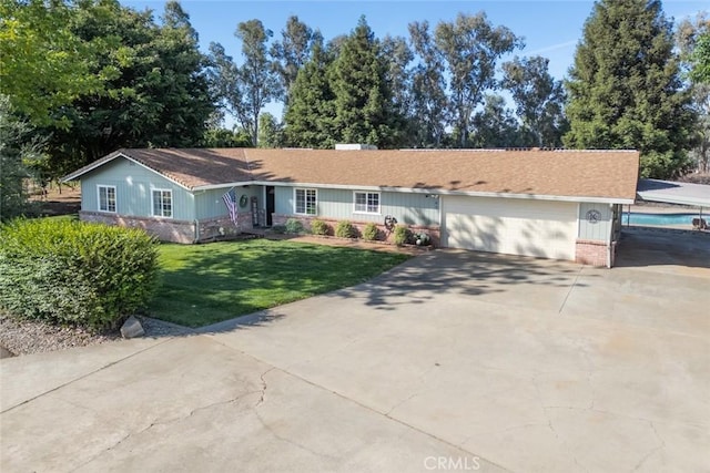 49 Bob Way, Oroville, CA 95965 - ranch-style house featuring concrete driveway, a garage, a front yard, and brick siding