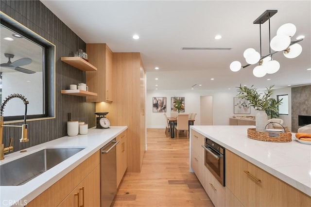 23240 Leonora Dr, Woodland Hills, CA 91367 - kitchen with a sink, appliances with stainless steel finishes, light wood-style flooring, modern cabinets, and recessed lighting