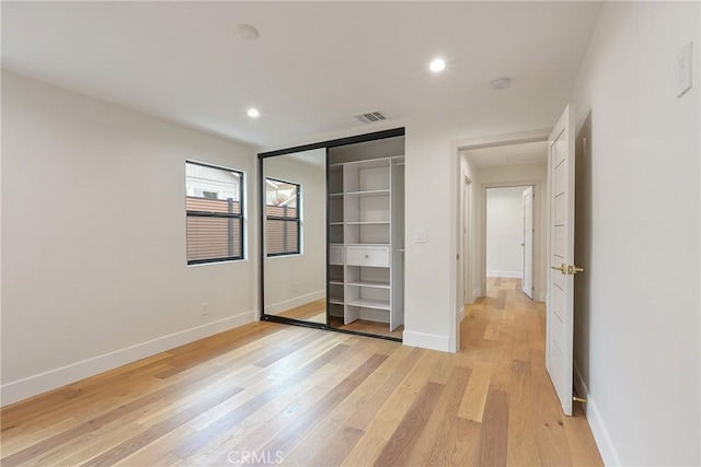 23240 Leonora Dr, Woodland Hills, CA 91367 - unfurnished bedroom with light wood finished floors, recessed lighting, attic access, baseboards, and a closet