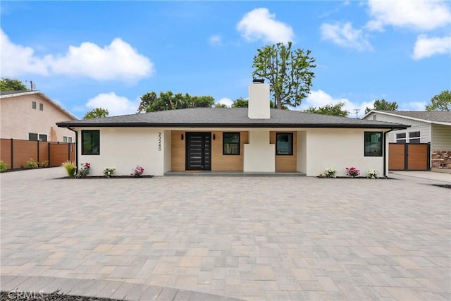 23240 Leonora Dr, Woodland Hills, CA 91367 - view of front of house with a chimney and stucco siding