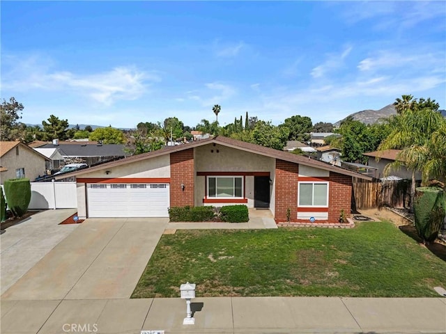 12705 Foreman Ave, Moreno Valley, CA 92553 - view of front of property featuring brick siding, driveway, an attached garage, and stucco siding