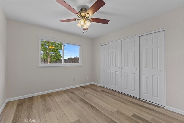 12705 Foreman Ave, Moreno Valley, CA 92553 - unfurnished bedroom with light wood-type flooring, baseboards, and a closet