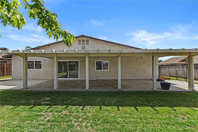 12705 Foreman Ave, Moreno Valley, CA 92553 - back of property with a patio, stucco siding, a pergola, and a ceiling fan