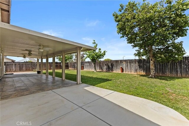 12705 Foreman Ave, Moreno Valley, CA 92553 - view of yard featuring a ceiling fan and a patio