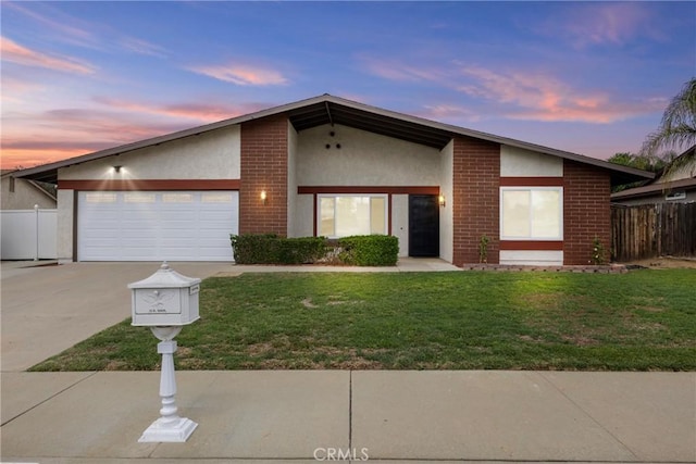 12705 Foreman Ave, Moreno Valley, CA 92553 - mid-century inspired home featuring driveway, brick siding, stucco siding, and a garage