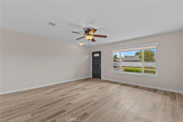 12705 Foreman Ave, Moreno Valley, CA 92553 - empty room with ceiling fan, light wood finished floors, and baseboards
