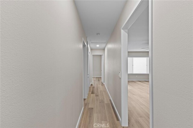 12705 Foreman Ave, Moreno Valley, CA 92553 - corridor with light wood-style floors, baseboards, a textured wall, and recessed lighting