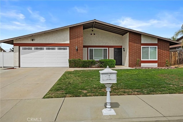 12705 Foreman Ave, Moreno Valley, CA 92553 - mid-century inspired home featuring stucco siding, an attached garage, concrete driveway, and brick siding