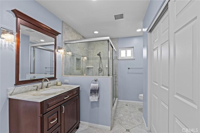 12705 Foreman Ave, Moreno Valley, CA 92553 - full bathroom with vanity, a shower stall, toilet, baseboards, and recessed lighting