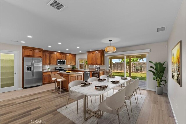 12705 Foreman Ave, Moreno Valley, CA 92553 - dining area with recessed lighting, baseboards, and light wood-type flooring
