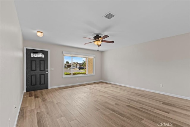 12705 Foreman Ave, Moreno Valley, CA 92553 - entryway with light wood-style flooring, ceiling fan, and baseboards