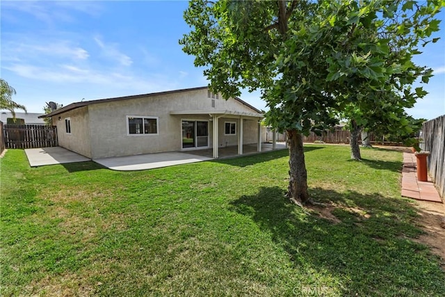 12705 Foreman Ave, Moreno Valley, CA 92553 - rear view of house featuring a patio and stucco siding