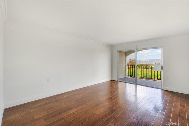 4004 Calle Sonora Oeste Unit 1F, Laguna Woods, CA 92637 - spare room with crown molding, baseboards, and dark wood finished floors
