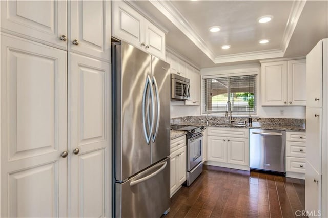 4004 Calle Sonora Oeste Unit 1F, Laguna Woods, CA 92637 - kitchen featuring stainless steel appliances, a sink, a tray ceiling, dark wood finished floors, and stone countertops