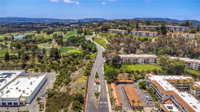 4004 Calle Sonora Oeste Unit 1F, Laguna Woods, CA 92637 - drone / aerial view of apartment complex, a water and mountain view, and a local golf course
