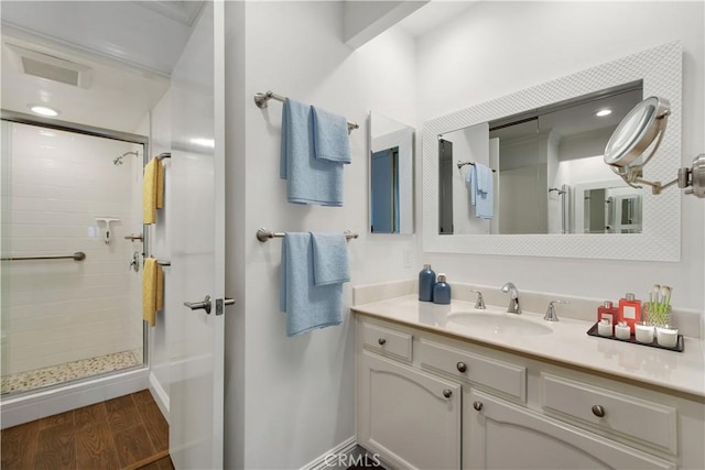 4004 Calle Sonora Oeste Unit 1F, Laguna Woods, CA 92637 - bathroom with a shower stall, vanity, wood finished floors, and baseboards