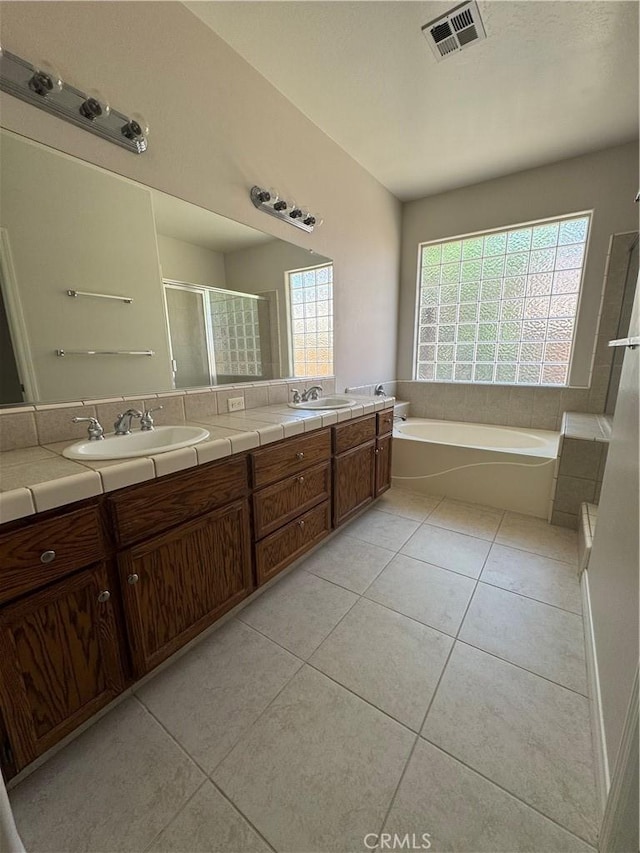 4809 Prairie Meadows Way, Bakersfield, CA 93312 - bathroom with tile patterned flooring, a shower stall, double vanity, and a bath