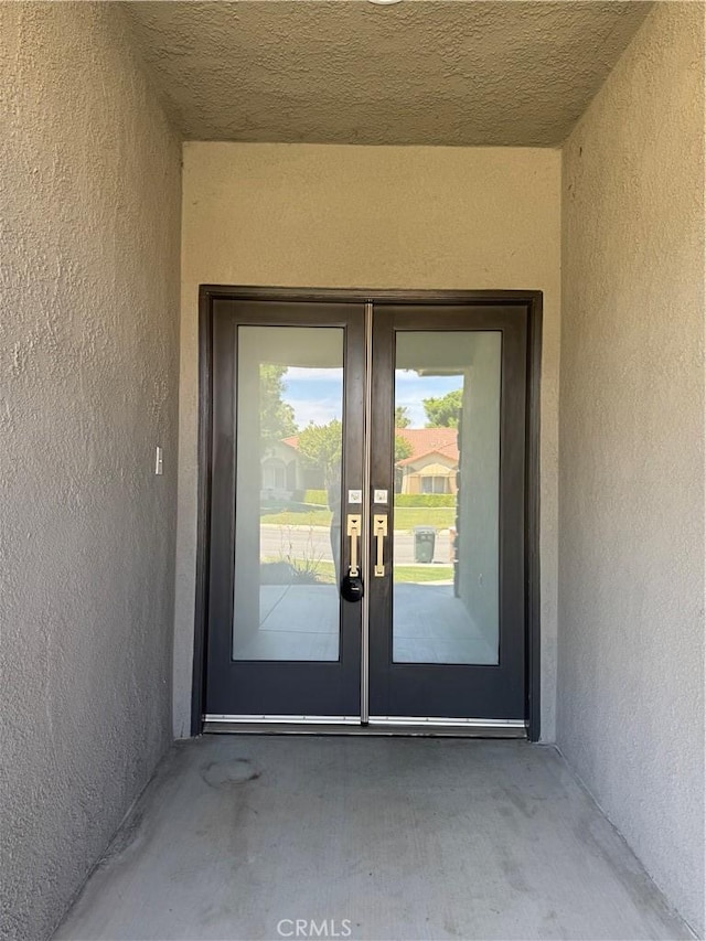 4809 Prairie Meadows Way, Bakersfield, CA 93312 - view of exterior entry featuring french doors and stucco siding