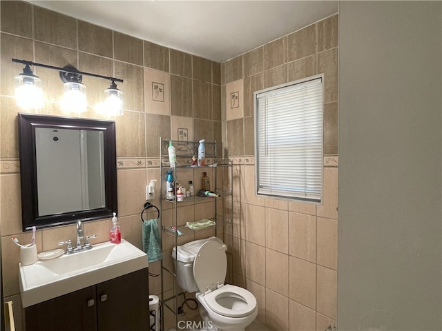6 Rawhide Ln, Carson, CA 90745 - bathroom featuring tile walls, toilet, and vanity