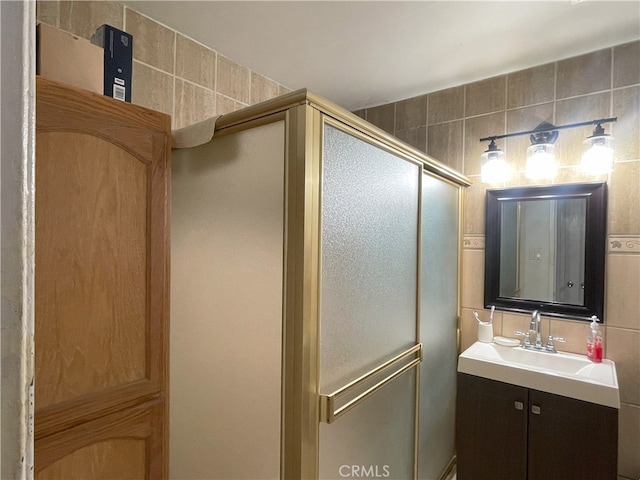 6 Rawhide Ln, Carson, CA 90745 - bathroom featuring a stall shower, vanity, and tile walls