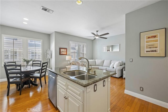 23423 Waterway Ln Unit 17, Valencia, CA 91355 - kitchen with a sink, baseboards, stainless steel dishwasher, light wood finished floors, and a ceiling fan