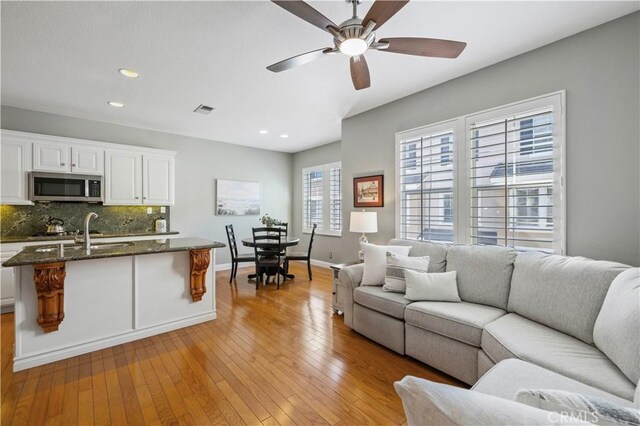 23423 Waterway Ln Unit 17, Valencia, CA 91355 - living room with a ceiling fan, recessed lighting, light wood finished floors, and baseboards