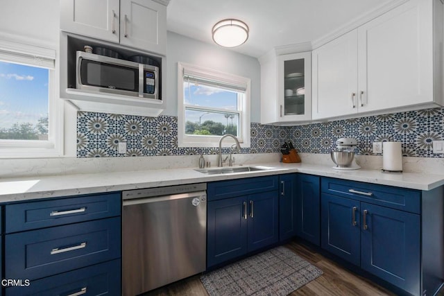 810 Selkirk St, Pasadena, CA 91103 - kitchen featuring appliances with stainless steel finishes, blue cabinets, a sink, and white cabinets