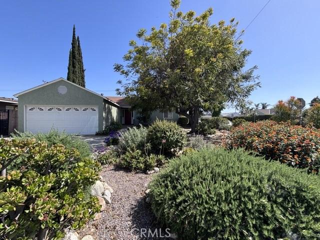 2020 W Swanee Ln, West Covina, CA 91790 - view of front of home featuring a garage and stucco siding