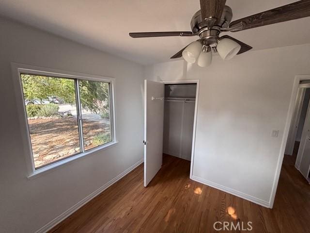 2020 W Swanee Ln, West Covina, CA 91790 - unfurnished bedroom with baseboards, wood finished floors, a closet, a ceiling fan, and vaulted ceiling
