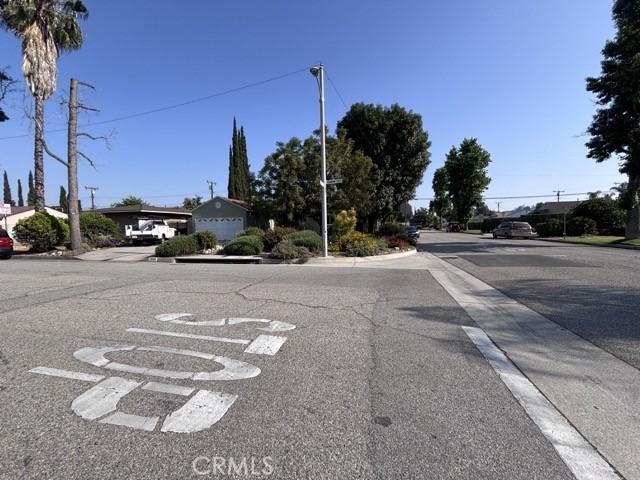 2020 W Swanee Ln, West Covina, CA 91790 - view of asphalt street featuring curbs, sidewalks, and street lights