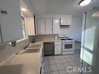 2020 W Swanee Ln, West Covina, CA 91790 - kitchen with white gas stove, dishwasher, white cabinetry, and light tile patterned flooring