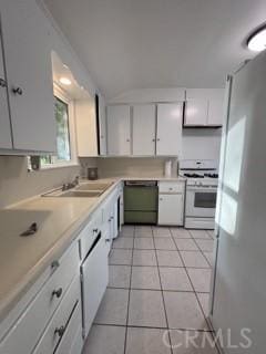 2020 W Swanee Ln, West Covina, CA 91790 - kitchen with white gas range, dishwasher, freestanding refrigerator, white cabinets, and a sink