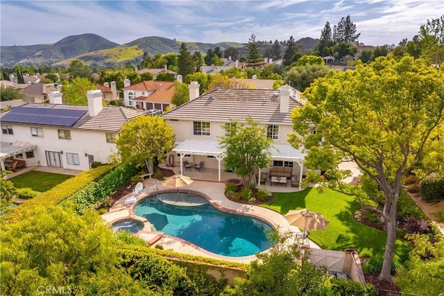 1280 Dumaine Ave, Oak Park, CA 91377 - view of pool featuring a pool with connected hot tub, a patio, a mountain view, and a residential view