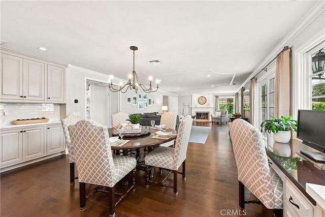 1280 Dumaine Ave, Oak Park, CA 91377 - dining space with a chandelier, plenty of natural light, recessed lighting, dark wood-style floors, and ornamental molding